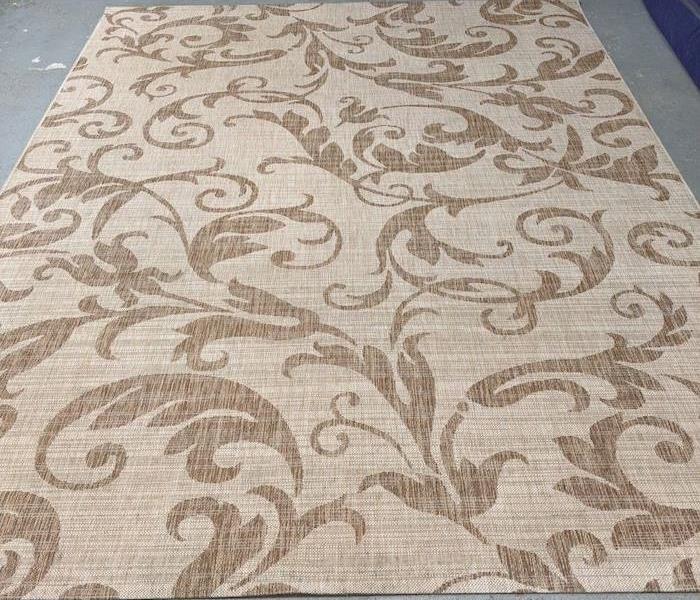 Beige rug with design 