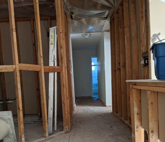 Home with sheetrock and floorboards stripped away