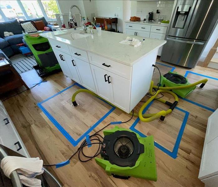 Targeted drying system on a wood floor.